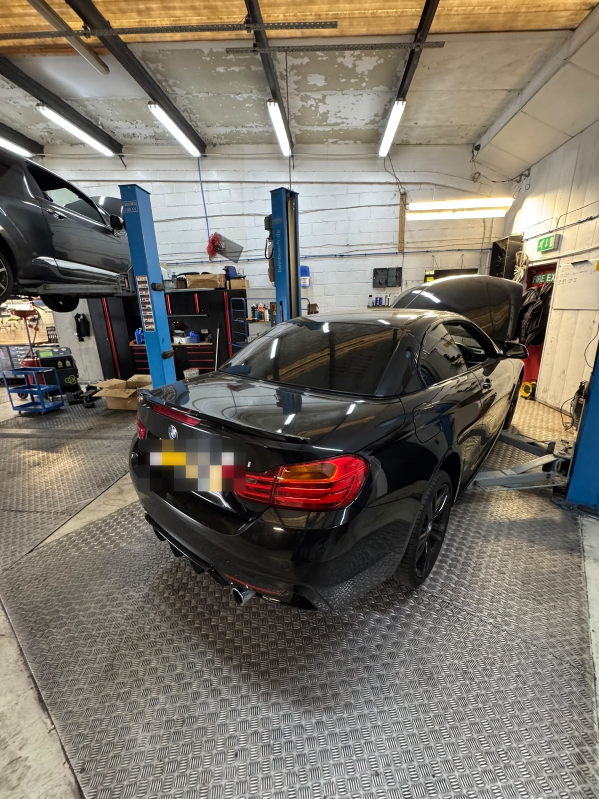 Car on the ramp for brakes and suspension